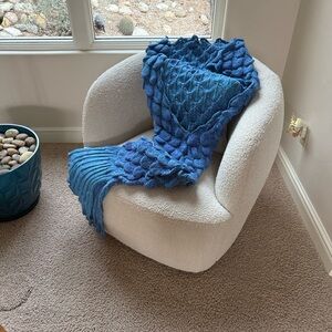 Long mermaid tail lap blanket. New. Never used. Blue and purple yarn. Great gift